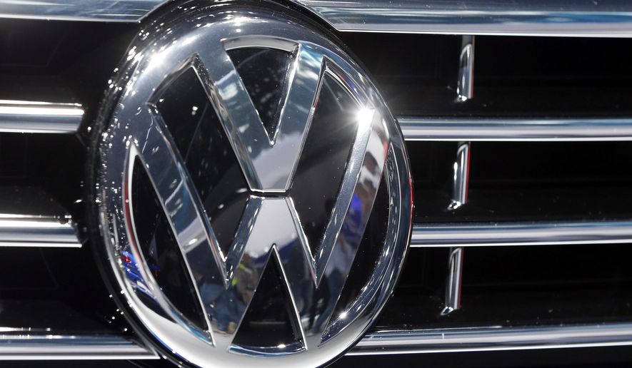 FILE - This Sept. 22, 2015, file photo, shows the Volkswagen logo on a car during the Car Show in Frankfurt, Germany. Volkswagen deleted documents and obstructed justice after the U.S. Environmental Protection accused the company of cheating on emissions tests, a former employee alleges in a lawsuit. Daniel Donovan says in a whistleblower case that he was wrongfully fired Dec. 6, 2015, after refusing to participate in the deletions and reporting them to a supervisor. The lawsuit says that the evidence deletion continued for three days after the Sept. 18 allegations from the EPA and despite a hold order from the Justice Department. (AP Photo/Michael Probst, File)