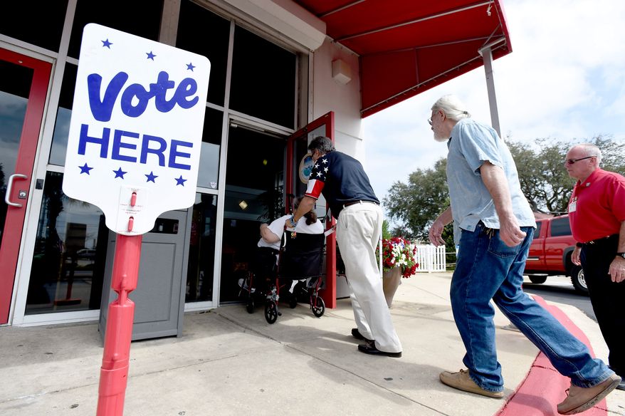 Voters walk into the Destin Community Center in Florida in this Tuesday, March 15, 2016, file photo. (Nick Tomecek/Northwest Florida Daily News via AP) ** FILE **