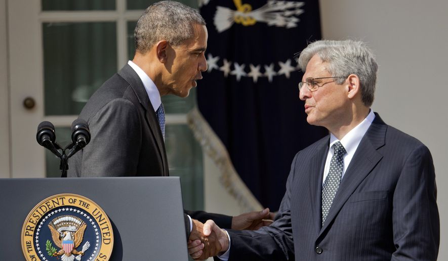 Federal appeals court judge Merrick Garland shakes hands with President Obama as he is introduced as Obama&#39;s nominee for the Supreme Court on Wednesday in the Rose Garden of the White House. (Associated Press)