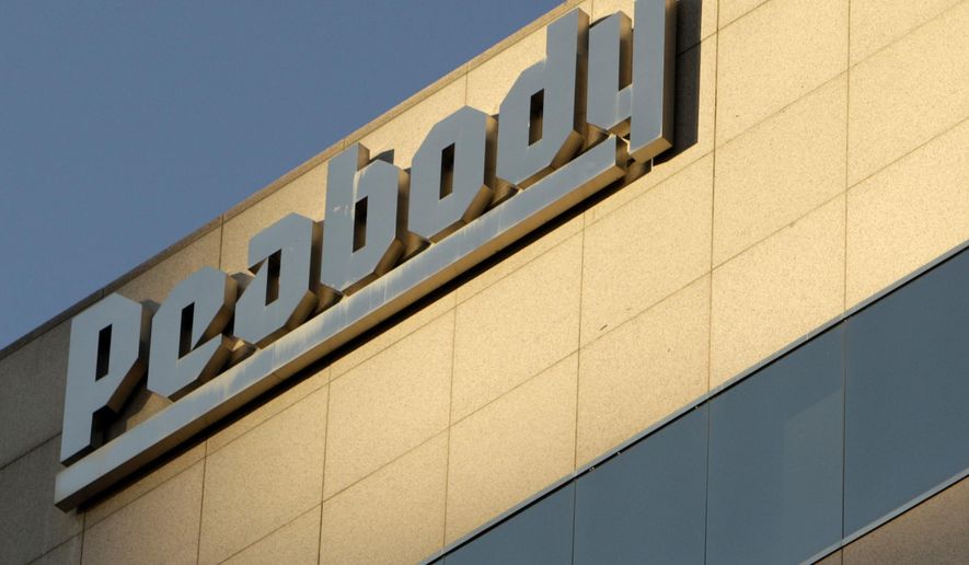 FILE - This Oct. 19, 2009, file photo shows Peabody Energy headquarters in St. Louis. Peabody Energy, hurt by weak demand for coal, says it didn’t have the cash to pay a debt payment due Tuesday, March 15, 2016, and warned that it may have to file for Chapter 11 bankruptcy protection. (AP Photo/Jeff Roberson, File)