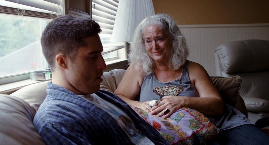 This image released by A24 Films shows director Trey Edward Shults, left, with Krisha Fairchild during the filming of, "Krisha." Shults made his debut film in nine days with less than $100,000, shooting at his mother's house and starring his aunt. The resulting film "Krisha" has earned acclaim, been celebrated at festivals from SXSW to Cannes and earned a Spirit Award. (A24 Films via AP)
