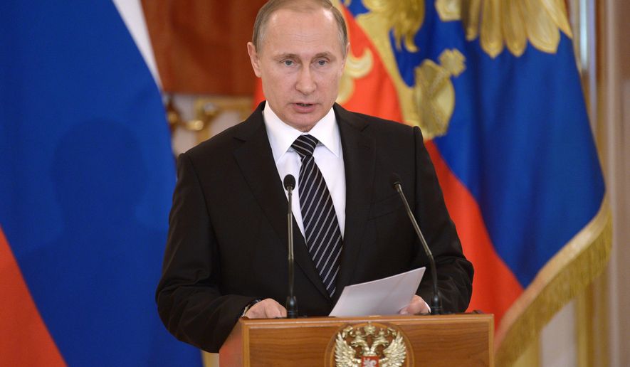 Russian President Vladimir Putin addresses members of the military in Moscow&#39;s Kremlin, Russia on Thursday, March 17, 2016. President Vladimir Putin says Russia can again build up its forces in Syria “in a few hours” if necessary, and will continue striking extremist groups. Putin made the statement in the Kremlin Thursday while honoring Russian military officers who have taken part in the Syrian campaign. (Alexei Nikolsky/Sputnik, Kremlin Pool Photo via AP)