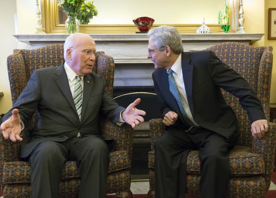 Sen. Patrick Leahy, D-Vt., left, the top Democrat on the Senate Judiciary Committee talks with Judge Merrick Garland, President Barack Obama’s choice to replace the late Justice Antonin Scalia on the Supreme Court, on Capitol Hill in Washington, Thursday, March 17, 2016. (AP Photo/J. Scott Applewhite)