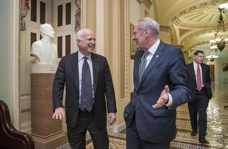 FILE - In this Feb. 3, 2016 file photo Senate Armed Services Committee Chairman Sen. John McCain, R-Ariz., left, talks with Sen. Dan Coats, R-Ind., followed by Sen. John Barrasso, R-Wyo., as they walk to a closed-door meeting with fellow Republicans during work on the energy reform bill on Capitol Hill in Washington. Coats is one of the five senators who will meet with the Polish president Duda on Saturday, March 19, 2016, after McCain was one of three senators who sent a letter to Polish Prime Minister Beata Szydlo in February expressing their concerns over the rule of law. (AP Photo/J. Scott Applewhite, file)