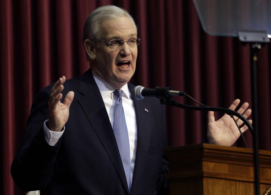 File- This Jan. 20. 2016, file photo shows Missouri Gov. Jay Nixon delivering the annual State of the State address to a joint session of the House and Senate in Jefferson City, Mo. Nixon on Friday, March 18, 2016, vetoed legislation requiring public employees to annually reauthorize paying their union dues through paycheck withholdings, setting up a confrontation with Republican leaders who say they have enough votes to overrule him. (AP Photo/Jeff Roberson, File)
