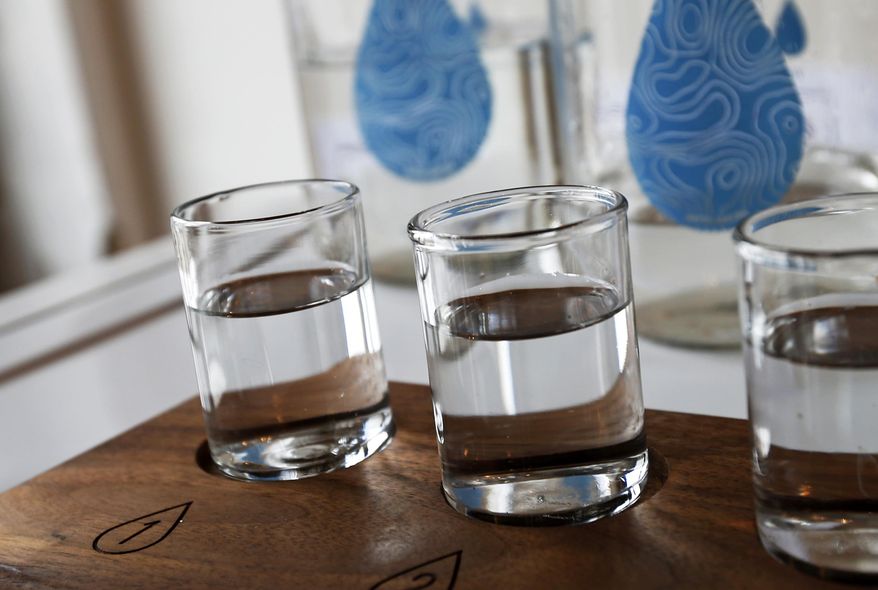 ADVANCE FOR SUNDAY, MARCH 20 - In this photo taken March 16, 2016, glasses of water are shown in the building where Colin Kloecker and his wife Shanai Matteson are preparing to open a storefront Water Bar in northeast Minneapolis, a taproom serving pints of free city water plus limited-edition pours from other communities. (AP Photo/Jim Mone)