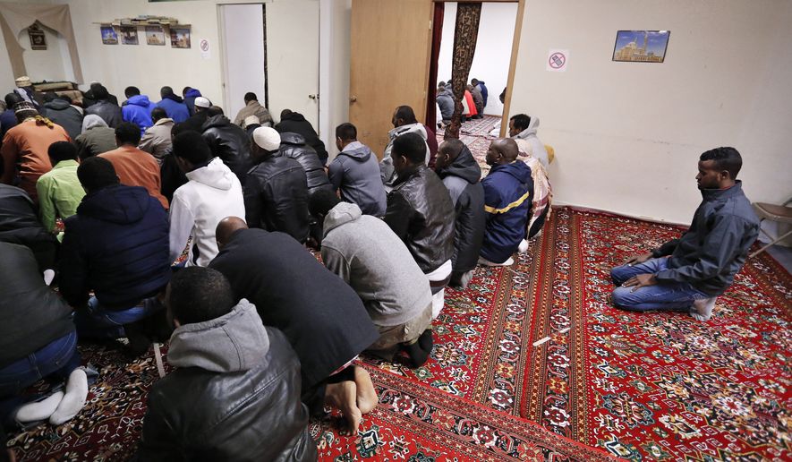 A group of largely-Somali immigrants and refugees observes the weekly Friday Muslim prayer inside a makeshift mosque in Fort Morgan, a small farming town on the eastern plains of Colorado. (Associated Press)