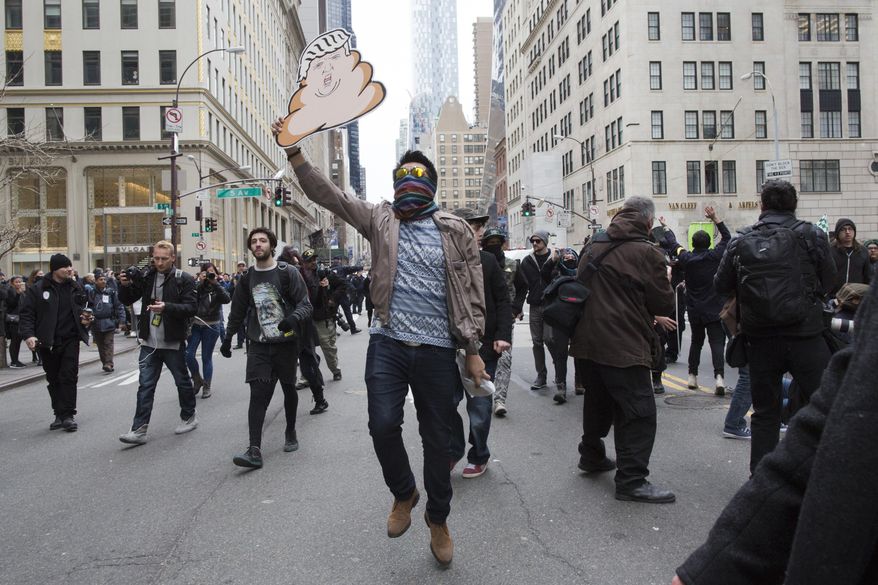 Demonstrators take to the street on during an anti Donald Trump protest, Saturday, March 19, 2016, in New York. Several hundred demonstrators gathered in New York City to protest Republican presidential hopeful Trump. (AP Photo/Mary Altaffer)
