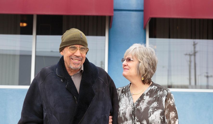ADVANCE FOR SATURDAY MARCH 19 AND THEREAFTER - In a Feb. 16, 2016 photo, Shadi and Becky Aboushady stand in front of Bella Italia, their Italian restaurant, in Cozad, Neb. Aboushady is trying to sell Bella Italia, their Italian restaurant in Cozad because he has undergone a number of heart surgeries. (Matt Miller/The World-Herald via AP)