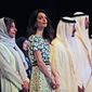 Amal Alamuddin Clooney, writer, human rights activist, 3rd left, listens to the national anthem during the opening ceremony of the International Government Communications Forum in Sharjah, United Arab Emirates, Sunday, March 20, 2016. (AP Photo/Kamran Jebreili)