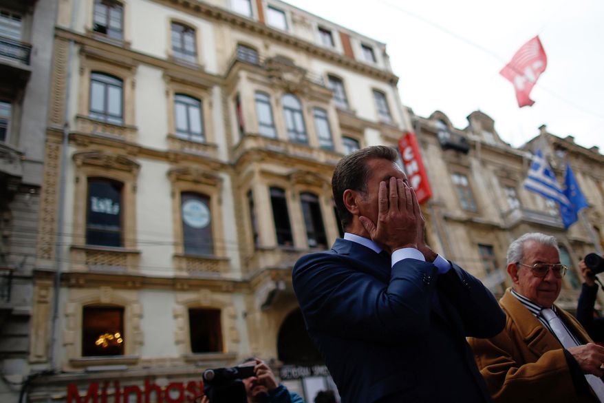 A man stands in front of the Saturday explosion site in Istanbul, Sunday, March 20, 2016. A suicide attack on Istanbul's main pedestrian shopping street Saturday killed a number of people, including two dual nationality Israeli-Americans and one Iranian citizen, and wounded several dozen others, in the sixth suicide bombing in Turkey in the past year.(AP Photo/Emrah Gurel)