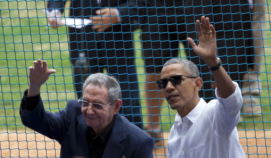 U.S. President Barack Obama, right, and his Cuban counterpart Raul Castro wave to cheering fans as they arrive for a baseball game between the Tampa Bay Rays and the Cuban national baseball team, in Havana, Cuba, Tuesday, March 22, 2016. The crowd roared as Obama and Cuban President Raul Castro entered the stadium and walked toward their seats in the VIP section behind home plate. It&#39;s the first game featuring an MLB team in Cuba since the Baltimore Orioles played in the country in 1999. (AP Photo/Rebecca Blackwell)