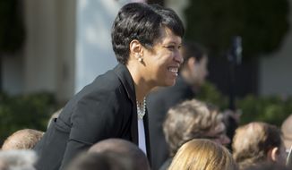 D.C. Mayor Muriel Bowser takes her seat before federal appeals court Judge Merrick Garland is introduced as President Barack Obama&#39;s nominee for the Supreme Court during an announcement in the Rose Garden of the White House, in Washington, Wednesday, March 16, 2016. (AP Photo/Pablo Martinez Monsivais)