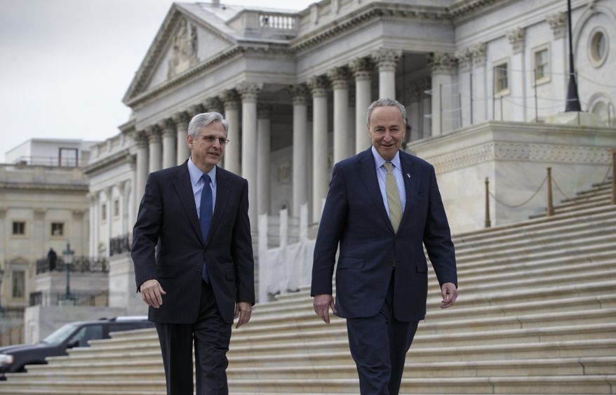 Senate Judiciary Committee member Sen. Charles Schumer, D-N.Y., right, which considers judicial nominations, walks with Judge Merrick Garland, President Barack Obama’s choice to replace the late Justice Antonin Scalia on the Supreme Court, Tuesday, March 22, 2016, on Capitol Hill in Washington. Senate Majority Leader Mitch McConnell of Ky. has been steadfast in his refusal to hold a confirmation hearing for any nominee during the waning months of Obama’s presidency. (AP Photo/J. Scott Applewhite)