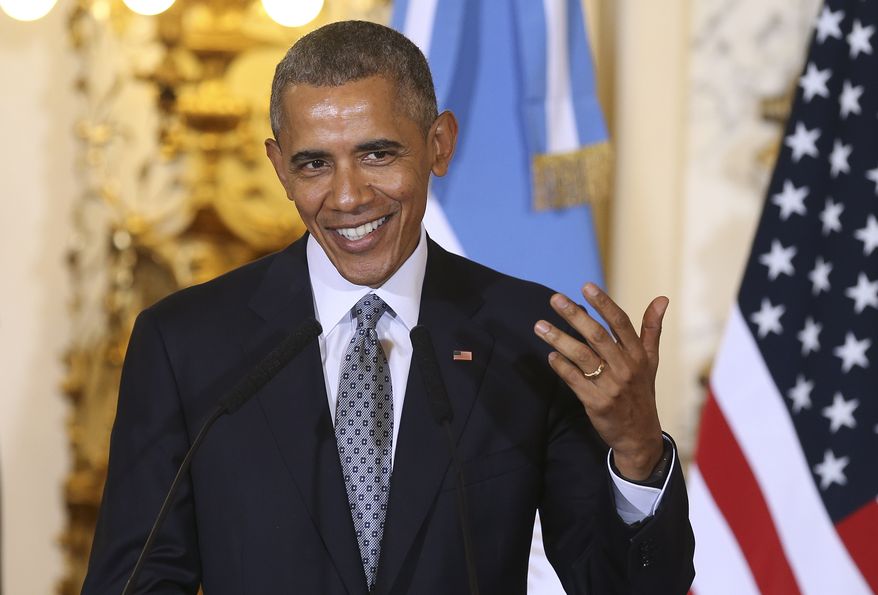 U.S. President Barack Obama shares a light moment during a joint news conference with Argentine President Mauricio Macri, at the Casa Rosada Presidential Palace in Buenos Aires, Argentina, Wednesday, March 23, 2016. Obama is on a two day official visit to Argentina. (David Fernandez/Pool Photo via AP)