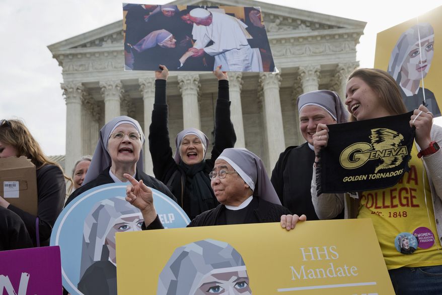 Nuns with the Little Sisters of The Poor, including Sister Celestine, left, and Sister Jeanne Veronique, center, rally outside the Supreme Court in Washington, Wednesday, March 23, 2016, as the court hears arguments to allow birth control in health care plans in the Zubik vs. Burwell case. (AP Photo/Jacquelyn Martin) ** FILE **