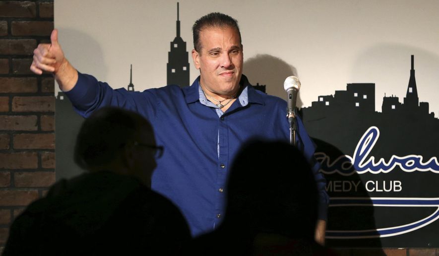 In this March 20, 2016 photo, actor-comedian Carlo Goias, of Toms River, N.J., gives a thumbs-up to an audience after a group comedians gave a benefit show for his legal defense at the Broadway Comedy Club in New York. Goias is facing 10 years in prison after he used a prop BB gun without a gun permit. He was charged under New Jersey's strict gun statute that requires permits for almost any fire arm, including the airsoft gun that Goias used while filming a car chase scene in an independent film. (AP Photo/Mel Evans)