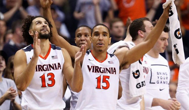 If Virginia beats Iowa State in its NCAA tournament Sweet 16 game on Friday, the senior class, led by forward Anthony Gill (13), guard Malcolm Brogdon (15) and center Mike Tobey will match the winningest class in program history with 112 victories. (Associated Press Photograph)