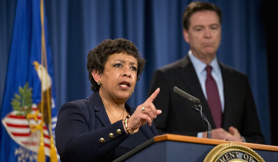 Attorney General Loretta Lynch, accompanied by FBI Director James Comey, speaks during a news conference at the Justice Department in Washington, Thursday, March 24, 2016. (AP Photo/Jacquelyn Martin) ** FILE **