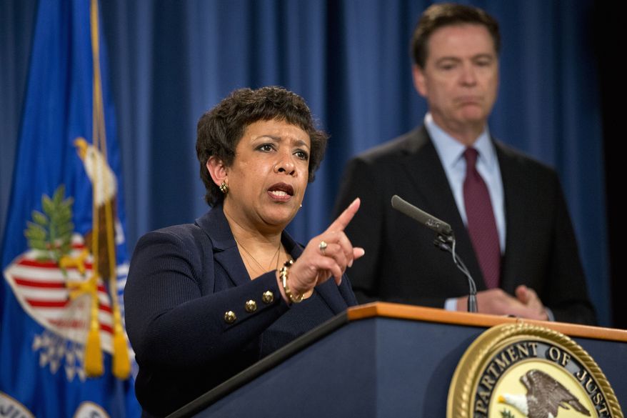 Attorney General Loretta Lynch, accompanied by FBI Director James Comey, speaks during a news conference at the Justice Department in Washington, Thursday, March 24, 2016. (AP Photo/Jacquelyn Martin) ** FILE **