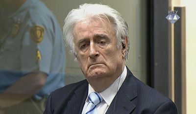 In this image taken from video Bosnian Serb wartime leader Radovan Karadzic listens to the verdict at the International Criminal Tribunal for Former Yugoslavia (ICTY) in The Hague, The Netherlands Thursday March 24, 2016. Karadzic was convicted of genocide and nine other charges Thursday at a U.N. court, and sentenced to 40 years in prison. (ICTY, Pool via AP)