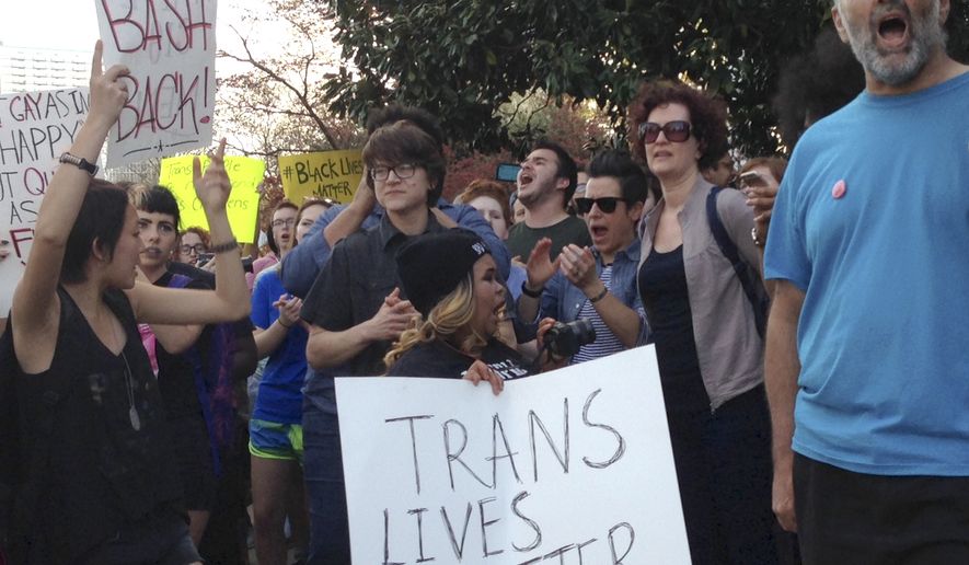 People protest outside the North Carolina Executive Mansion in Raleigh on March 24, 2016. North Carolina legislators decided to rein in local governments by approving a bill Wednesday that prevents cities and counties from passing their own anti-discrimination rules. North Carolina Gov. Pat McCrory later signed the legislation, which dealt a blow to the LGBT movement after success with protections in cities across the country. (Associated Press) **FILE**