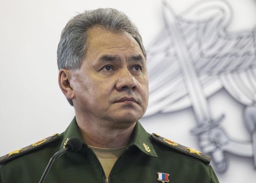 FILE In this file photo taken on Monday, Oct. 5, 2015, Russian Defence Minister Sergei Shoigu attends an opening ceremony during an Innovation exhibition of the Russian Defense Ministry in Kubinka outside Moscow, Russia. Shoigu said Friday, March 25, 2016 that NATO's moves to build up its military forces near Russia's borders has caused Moscow's concern and required a response. (AP Photo/Pavel Golovkin, File)