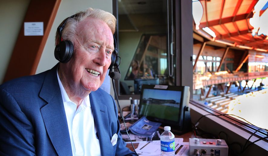 Legendary Los Angeles Dodgers broadcaster Vin Scully sits in the booth at Camelback Ranch Glendale, Ariz., ballpark Friday, March 25, 2016, the day of the last broadcast he will do from the park. (Tom Tingle/The Arizona Republic via AP)