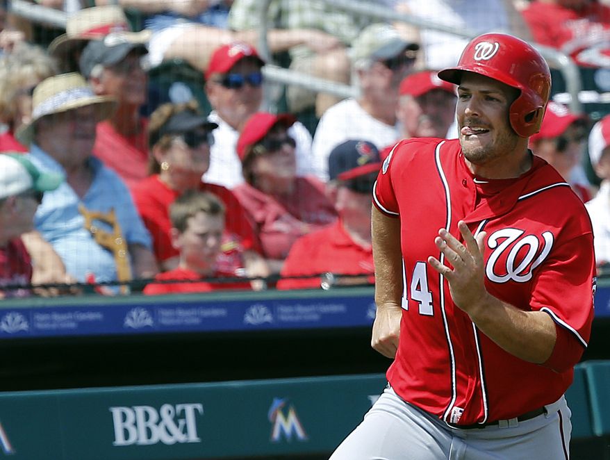 Washington Nationals&#39; baserunner Chris Heisey rounds third scoring during the fourth inning of an exhibition spring training baseball game against the St. Louis Cardinals, Saturday, March 26, 2016, in Jupiter, Fla. (AP Photo/Brynn Anderson)