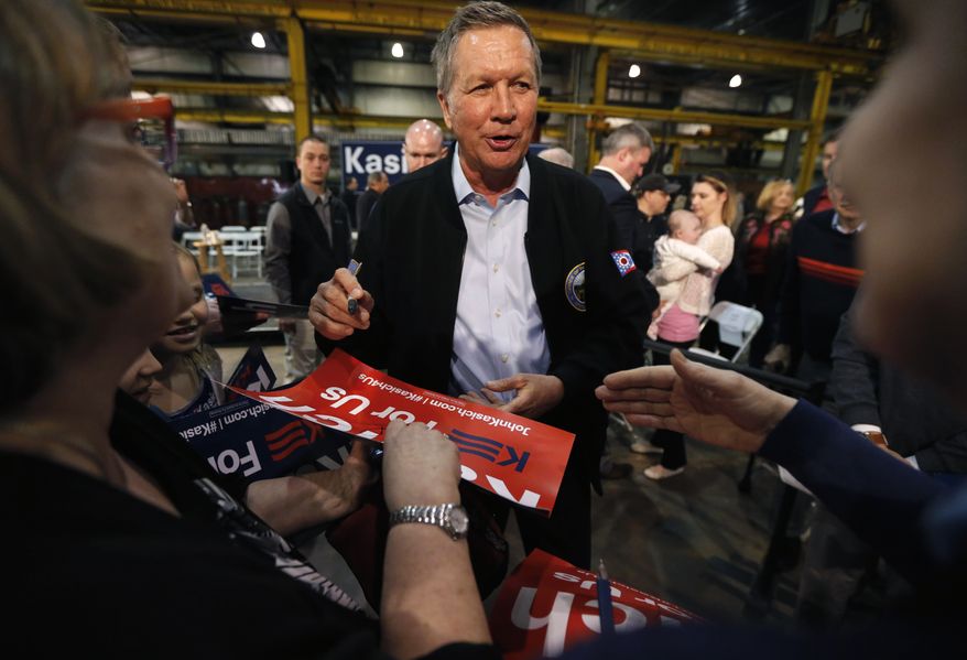 Republican presidential candidate, Ohio Gov. John Kasich works the crowd after a town hall meeting at the River Steel plant, Monday, March 28, 2016, in West Salem, Wis. (AP Photo/Charles Rex Arbogast)