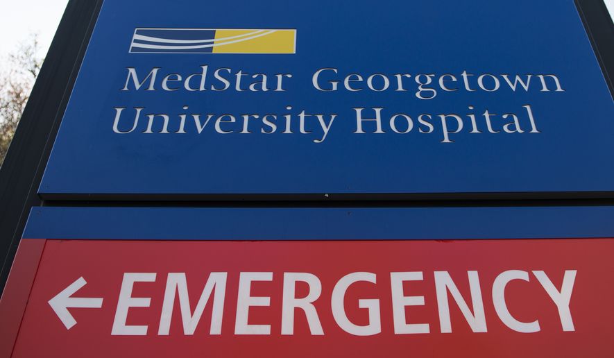 A sign designates an entrance to the MedStar Georgetown University Hospital in Washington, Monday, March 28, 2016.   (AP Photo/Molly Riley)  **FILE**