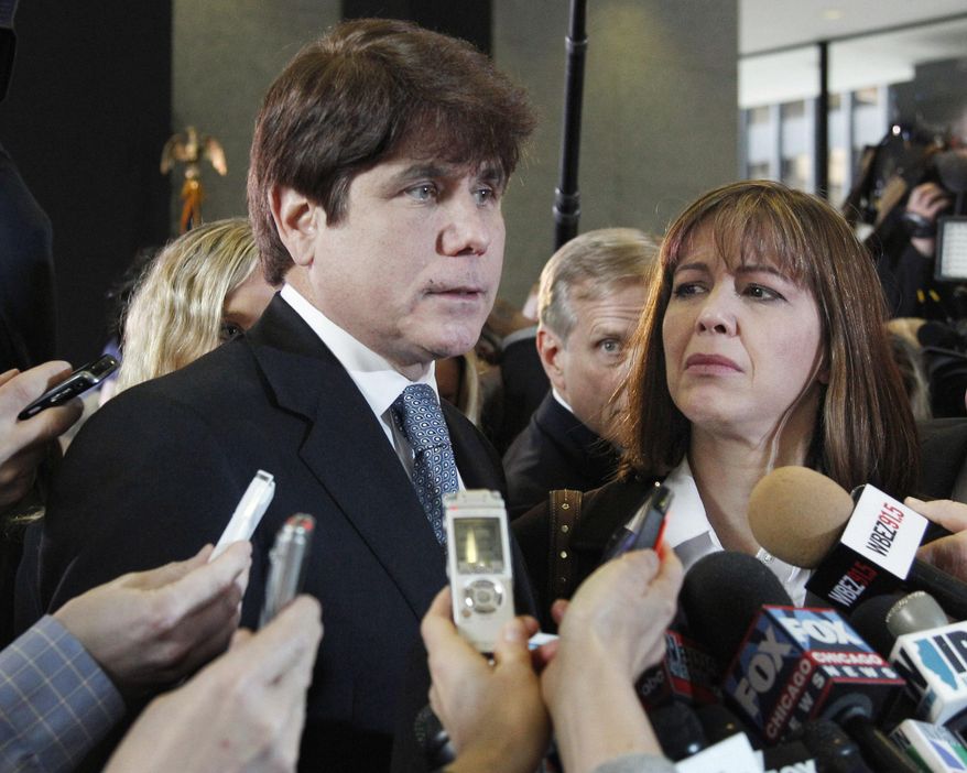 FILE - In this Dec. 7, 2011 file photo, former Illinois Gov. Rod Blagojevich, left, speaks to reporters as his wife, Patti, listens at the federal building in Chicago, after Blagojevich was sentenced to 14 years on 18 corruption counts. On Monday, March 28, 2016, the U.S. Supreme Court rejected Blagojevich's appeal of his corruption convictions that included his attempt to sell the vacant Senate seat once occupied by President Barack Obama. (AP Photo/M. Spencer Green, File)