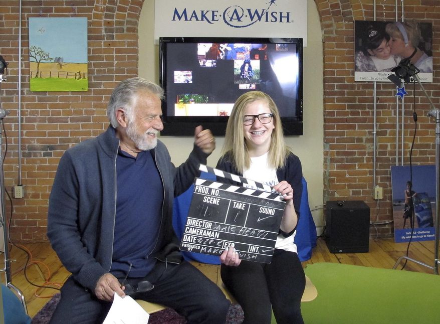 Jonathan Goldsmith, left, works on a public service announcement with Jamie Heath of Barre, Vt., Monday, March 28, 2016, at the Make-A-Wish Vermont office in Burlington, Vt. Goldsmith, who appeared for nine years as the "Most Interesting Man in the World," in Dos Equis beer commercials, will star in public service announcements for Make-a-Wish Foundation Vermont. The Mexican beer brand recently dropped the 77-year-old for a younger replacement, who will appear in commercials later this year. (AP Photo/Lisa Rathke)
