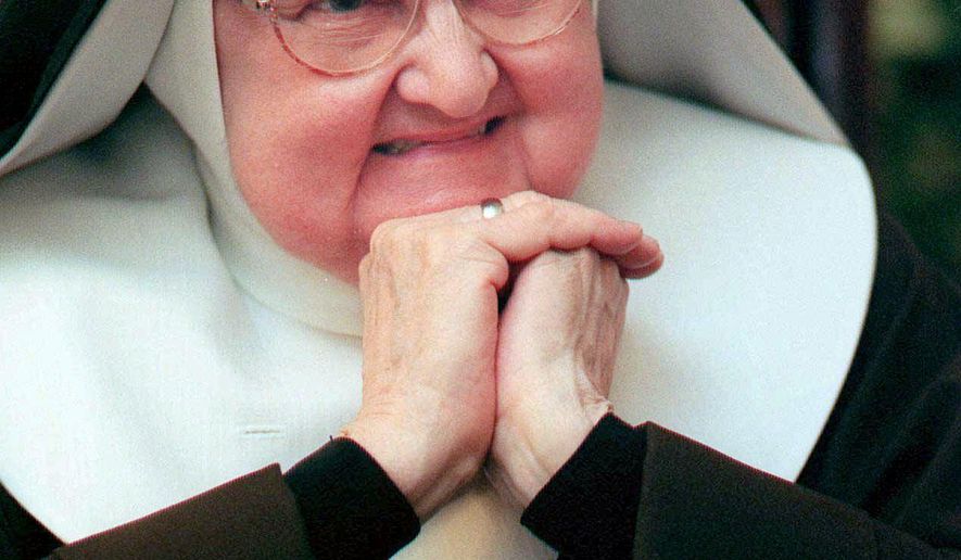 Mother Angelica, shown March 2, 1999, is both Mother Abbess of the Lady of Angels Monastery in Irondale, Ala., as well as chairman of the board or the Eternal Word Television Network.  Angelica, a folksy Roman Catholic nun who used a monastery garage to begin a television ministry that grew into a global religious media empire, had died. She was 92. (Philip Holman/Birmingham Post-Herald via AP)