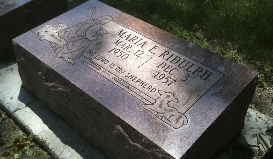 FILE - In this July 2, 2011 file photo, the grave marker of 7-year-old Maria Ridulph is seen at Elmwood Cemetery in Sycamore, Ill. Jack McCullough is serving a life sentence after being sentenced for Maria Ridulph's 1957 death. An Illinois judge on Tuesday, March 29, 2016, is expected to decide whether to accept a prosecutor's conclusion that McCullough could not have committed the murder he was convicted for. (AP Photo/Barbara Rodriguez, File)