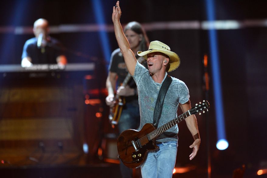 FILE - In this Sept. 18, 2015 file photo, Kenny Chesney performs at Day 1 of the 2015 iHeartRadio Music Festival at the MGM Grand Garden Arena in Las Vegas. Chesney is getting his own "No Shoes Radio" channel on satellite radio's SiriusXM, seeking more exposure for an online venture he started in 2008 to share music with fans. SiriusXM said Tuesday, March 29, 2016, that the service will launch on April 12. (Photo by Al Powers/Powers Imagery/Invision/AP)