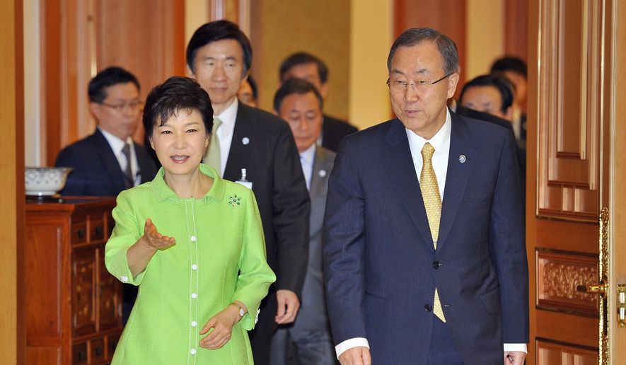 South Korean President Park Geun-hye, left, ushers U.N. Secretary-General Ban Ki-moon, right, at the presidential Blue House during their meeting in Seoul Friday, Aug. 23, 2013. (AP Photo/Jung Yeon-je, Pool)