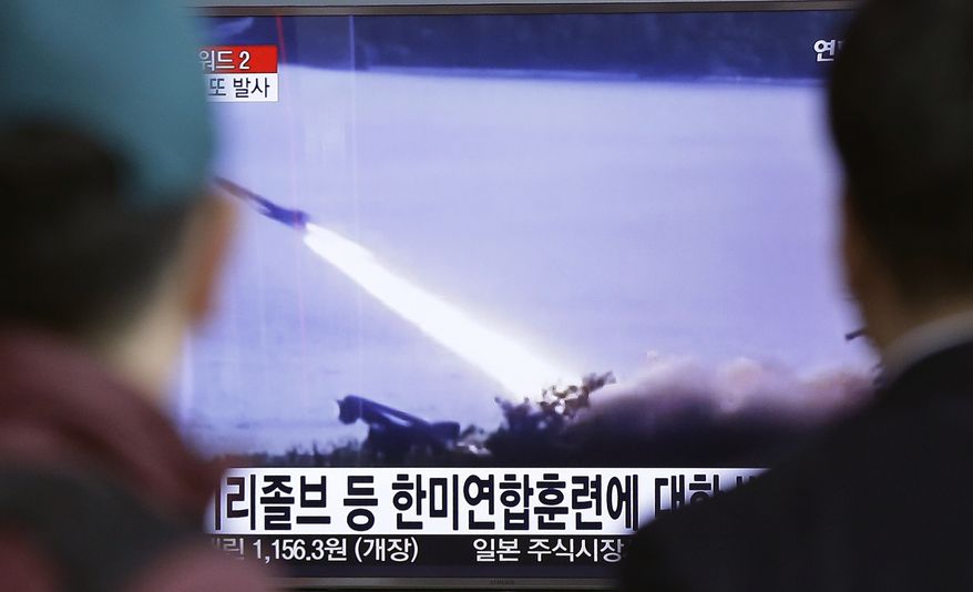 In this March 18, 2016 photo, people watch a TV screen showing a file footage of a missile launch conducted by North Korea, at Seoul Railway Station in Seoul, South Korea, soon after North Korea defied U.N. resolutions by firing a medium-range ballistic missile into the sea. It's a demand North Korea has been making for decades: The U.S. and South Korea must immediately suspend their annual military exercises if they want peace on the Korean Peninsula. And, once again, it's a demand that is falling on deaf ears. This year's exercises are bigger than ever before and reportedly include training to take out Kim Jong Un himself. For Pyongyang's ruling regime, that's a bridge too far. But probably not far enough to fire the first shots over. The letters on the screen read "North Korea fired a missile against the ongoing joint military exercises, dubbed Key Resolve and Foal Eagle, between South Korea and the United States." (AP Photo/Ahn Young-joon, File)