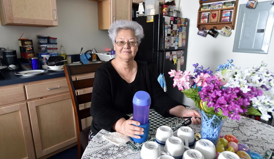 Dorothy Riggs, poses in her apartment on in Boulder, Colo., Wednesday, March 23, 2016. When a case manager told Riggs she would put her name "on the list," she wasn't quite sure what that meant. But it turned out to be life-changing. (David R. Jennings/Daily Camera via AP)