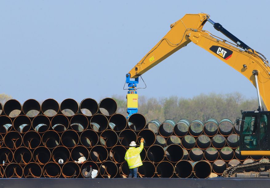 FILE - In this May 9, 2015 file photo, pipes for the proposed Dakota Access oil pipeline, that would stretch from the Bakken oil fields in North Dakota to Illinois, are stacked at a staging area in Worthing, S.D. On Friday, April 1, 2016, members of the Standing Rock Sioux and other tribes plan a protest ride against the proposed pipeline Friday, April 1, 2016, across the Standing Rock Reservation, which straddles the North Dakota-South Dakota border. (AP Photo/Nati Harnik, File)