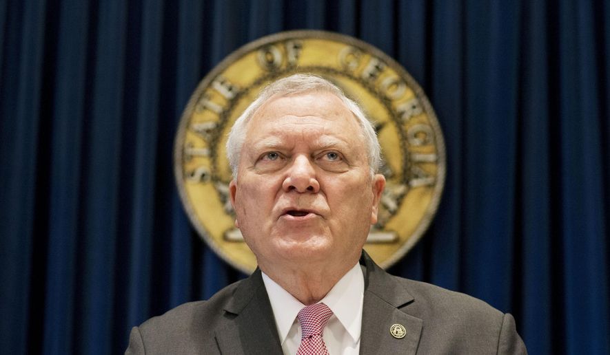 FILE - In this Monday, March 28, 2016 file photo, Georgia Gov. Nathan Deal speaks during a press conference to announce he has vetoed legislation allowing clergy to refuse performing gay marriage and protecting people who refuse to attend the ceremonies in Atlanta. Deal vetoed a proposed “religious expression” bill that pitted gay-rights groups and the business community against religious conservatives. Deal said he was preventing potential discrimination by rejecting a bill intended to protect individuals and businesses who declined to serve certain customers on religious grounds. (AP Photo/David Goldman, File)