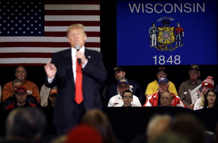Supporters listen to Republican presidential candidate Donald Trump speech at a campaign stop Wednesday, March 30, 2016, in Appleton, Wis. (AP Photo/Nam Y. Huh)