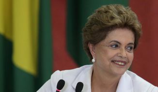 Brazil&#39;s President Dilma Rousseff smiles during the launching ceremony of the third stage of Minha Casa Minha Vida Program, at the Planalto Presidential Palace in Brasilia, Brazil, Wednesday, March 30, 2016. Former Brazilian President Luiz Inacio Lula da Silva said Monday that he believes Rousseff, his embattled successor and protege, can survive mounting pressure in Congress for her impeachment. Rousseff recently appointed Silva as her chief of staff in a much-discussed move that still must be confirmed by Brazil&#39;s top court. (AP Photo/Eraldo Peres)