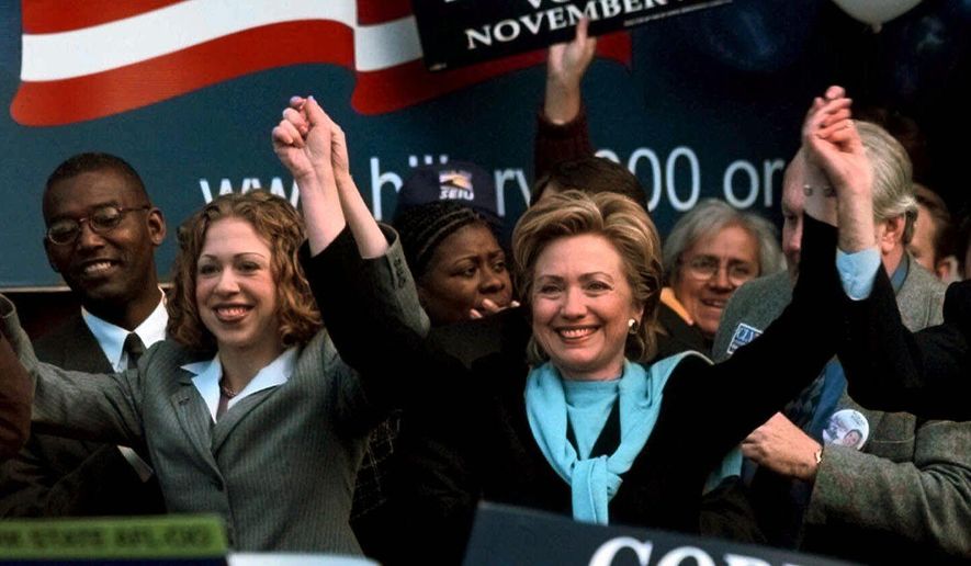 ADVANCE FOR SUNDAY, APRIL 3, 2016 AND THEREAFTER - FILE - In this Nov. 6, 2000 file photo, U.S. Senate candidate then first lady Hillary Clinton and her daughter Chelsea react at the end of a rally at the Albany, N.Y., City Hall. (AP Photo/ Jim McKnight, File)