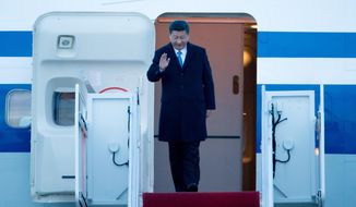 Chinese President Xi Jinping arrives at Andrews Air Force Base, Md., Wednesday, March 30, 2016. Xi is in Washington to attend the Nuclear Security Summit. (AP Photo/Andrew Harnik)