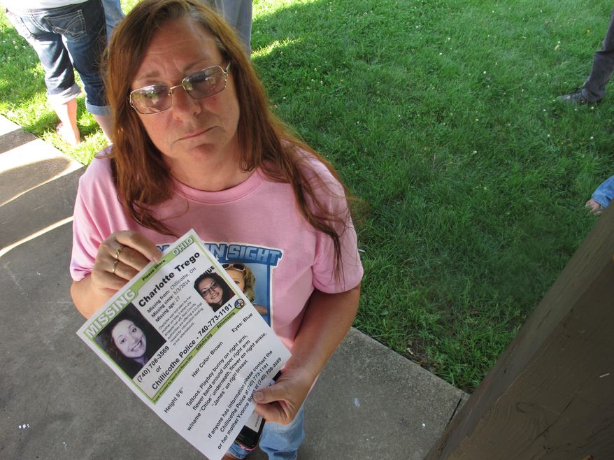 FILE - In this June 24, 2015, file photo, Yvonne Boggs holds a flier seeking information on her daughter, Charlotte Trego, who has been missing for more than a year, in Chillicothe, Ohio. The Investigation Discovery network says it will air its first-ever serialized drama later this spring. The six-part docu-series, "The Vanishing Women," will focus on six women who have gone missing or been found dead in Chillicothe, Ohio, over the past few years. Missing women Trego and Wanda Lemons haven't been seen by loved ones since 2014. It will debut June 6, ID announced on Thursday, March 31, 2016. (AP Photo/Andrew Welsh-Huggins, File)