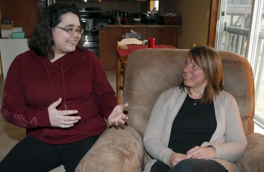 In a Thursday, March 24 photo, Laura Evans, left, of Rochester, Minn., who had a bone marrow transplant in 2009, meets her donor, Carin Harrison, of Sweden, for the first time in Rochester, Minn. "She's special to me," said Evans. (Elizabeth Nida Obert/Rochester Post-Bulletin via AP).