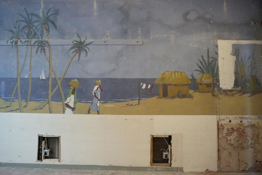 This Wednesday, March 2, 2016 photo shows a large mural discovered in July 2015, painted by artist Lester W. Bentley in the two-car garage of the West of the Lake Gardens 1934 original building in Manitowoc, Wis. (Yi-Chin Lee/Herald-Times Reporter via AP) NO SALES; MANDATORY CREDIT