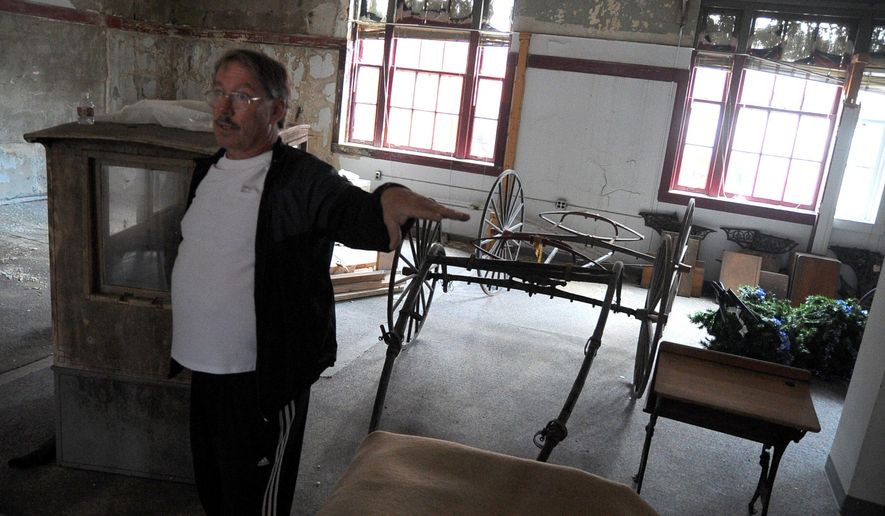 Lenny Hauersperger, president of the Seymour Museum board, talks about plans for the inside of the museum on March 29, 2016 in Seymour, Ind. Hauersperger said he is well aware of the amount of time, work and money needed to transform the old Federal Building, built in 1915 and first used in 1918 as a post office, from its current state of disrepair into a museum showcasing Seymour's history. (Zach Spicer/The Tribune via AP) MANDATORY CREDIT