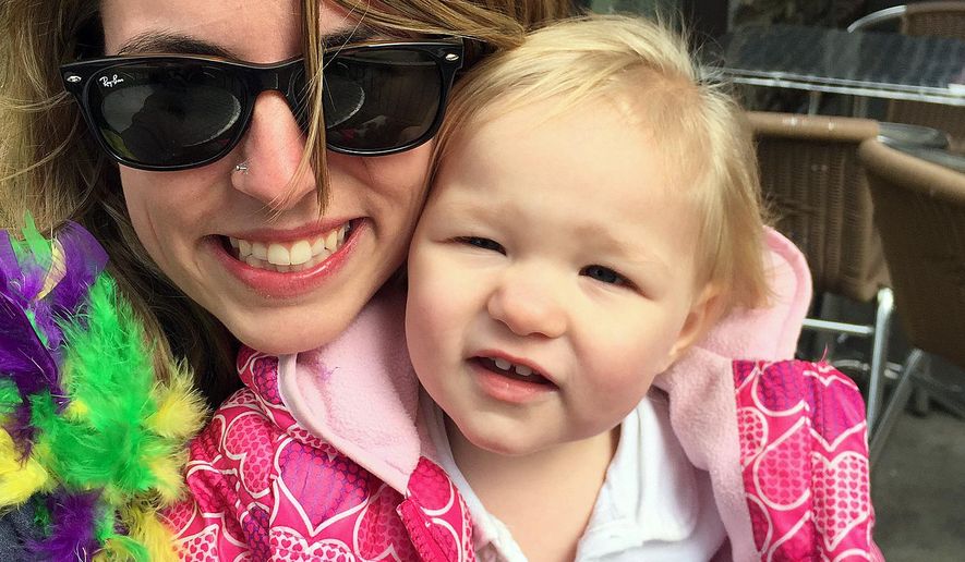 In this undated photo released by Brittany Hudson, Hudson holds her 16-month-old daughter Braylee, in Tenn. Hudson, who is a recovering painkiller addict, gave birth to the girl in the backseat of a car on the side of a road. The girl was born dependent on drugs because of her mothers' drug abuse while pregnant. Hudson says the child, who is now 17 months old, is now healthy. (Brittany Hudson via Brittany Hudson)